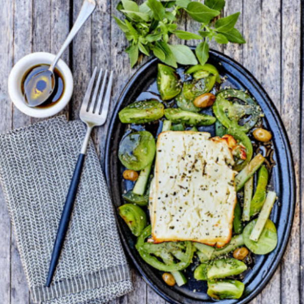 Green tomato salad with grilled feta cheese